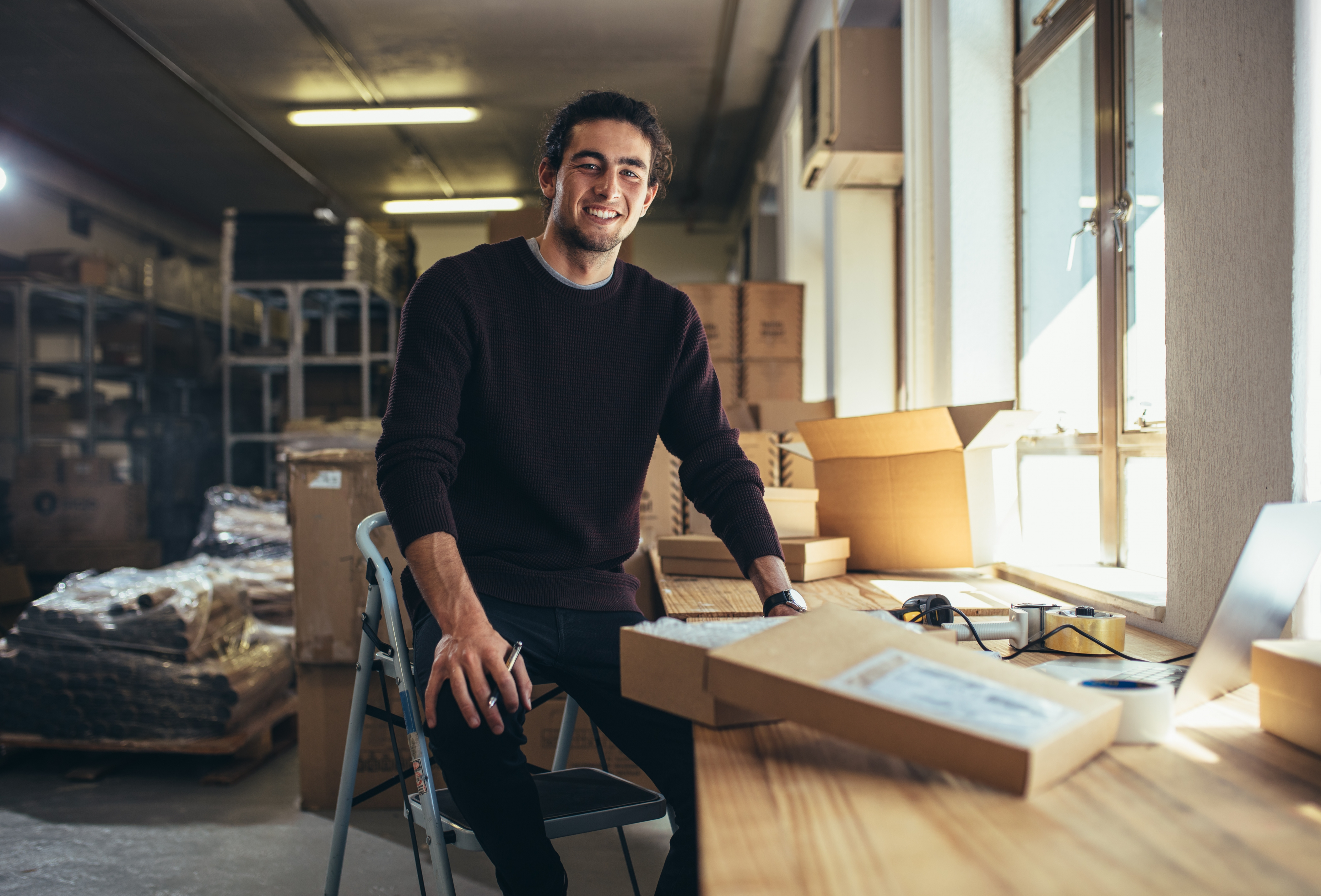 Small business owner packaging products